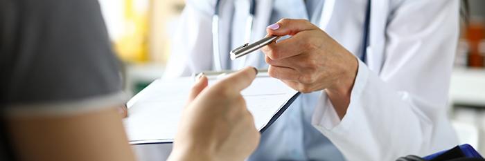 A health care professional talking to a patient