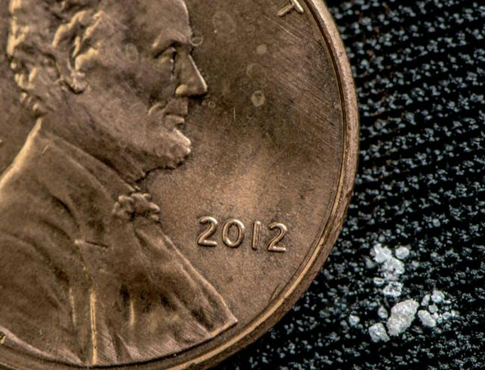 Just two milligrams of fentanyl appears as a few grains of sand in comparison to a U.S. penny.
