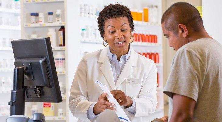 A pharmacist helping a patient